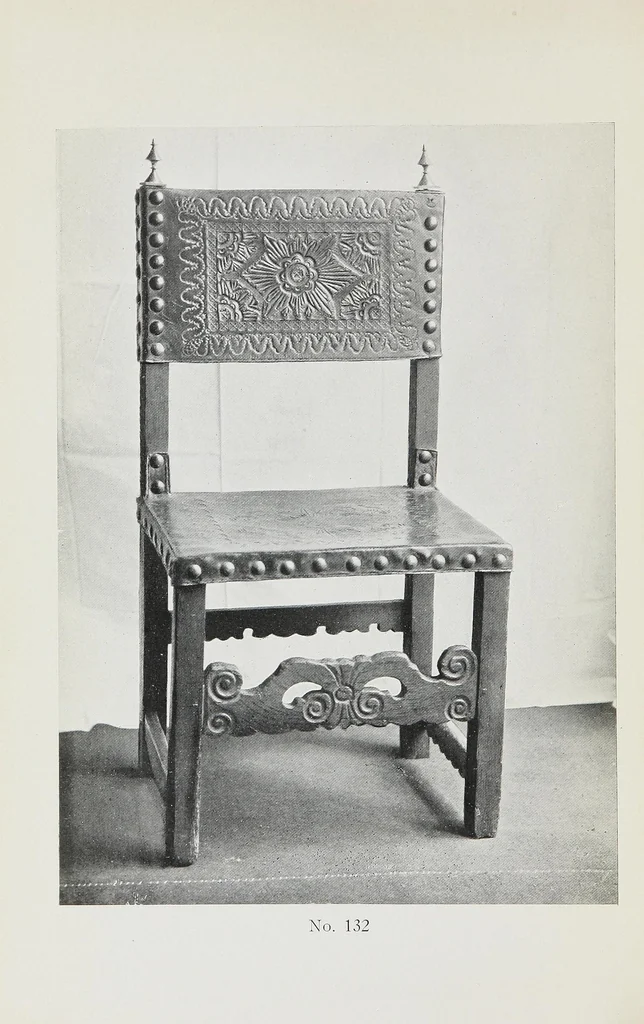 An illustration from Catalogue of the highly interesting and valuable collection of authentic Spanish antiques formed by Señor Luis Ruiz... : silver cathedral lanterns of the XVII century, the very rare carpets of the XVI & XVII century, the primitive paintings with their Gothic frames, also the wood and stone carvings, the Barguenos, cabinets, chests and chairs, the iron work and the old laces and fabrics, 1921, leaf 4