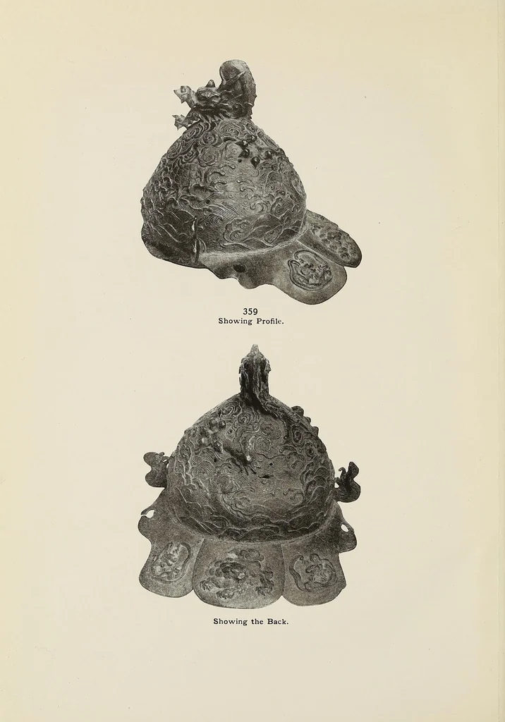 An illustration from Catalogue of arms and armor of old Japan : examples of the famous Miyochin's, and others celebrated for their work in metals : also sword guards, knife handles, pewter, carvings, brocades and other objects of interest to amateurs and connoisseurs :gathered on a recent visit to Japan by Bunkio Matsuki, 1905, leaf 106