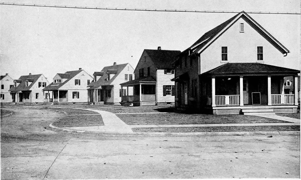 An illustration from The housing book; containing photographic reproductions, with floor plans of workingmen's homes. One and two family houses of frame, brick, stucco and concrete construction; also four, six and nine family apartments. Showing single houses, groups and developments that have been built in various parts of the United States, 1919, leaf 23