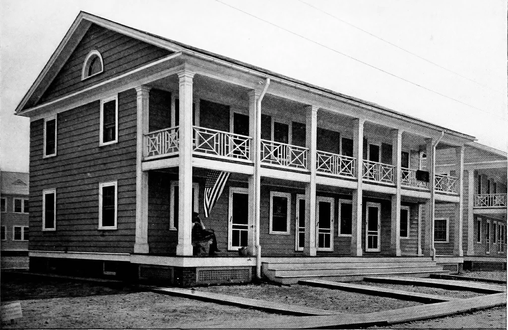 An illustration from The housing book; containing photographic reproductions, with floor plans of workingmen's homes. One and two family houses of frame, brick, stucco and concrete construction; also four, six and nine family apartments. Showing single houses, groups and developments that have been built in various parts of the United States, 1919, leaf 60