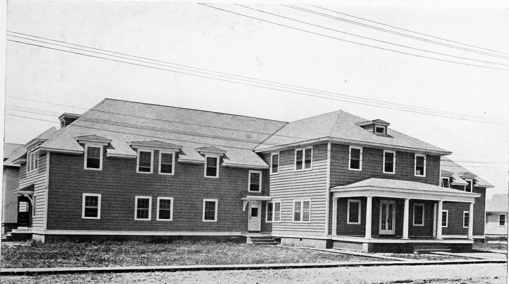 An illustration from The housing book; containing photographic reproductions, with floor plans of workingmen's homes. One and two family houses of frame, brick, stucco and concrete construction; also four, six and nine family apartments. Showing single houses, groups and developments that have been built in various parts of the United States, 1919, leaf 64