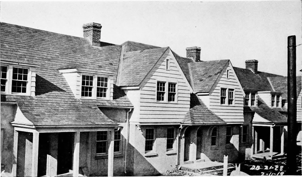 An illustration from The housing book; containing photographic reproductions, with floor plans of workingmen's homes. One and two family houses of frame, brick, stucco and concrete construction; also four, six and nine family apartments. Showing single houses, groups and developments that have been built in various parts of the United States, 1919, leaf 71