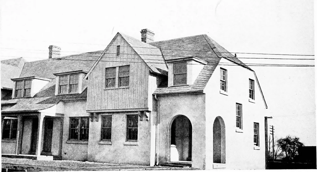 An illustration from The housing book; containing photographic reproductions, with floor plans of workingmen's homes. One and two family houses of frame, brick, stucco and concrete construction; also four, six and nine family apartments. Showing single houses, groups and developments that have been built in various parts of the United States, 1919, leaf 73