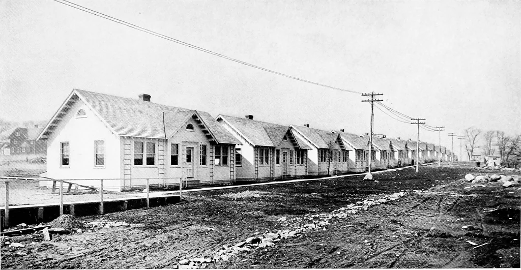 An illustration from The housing book; containing photographic reproductions, with floor plans of workingmen's homes. One and two family houses of frame, brick, stucco and concrete construction; also four, six and nine family apartments. Showing single houses, groups and developments that have been built in various parts of the United States, 1919, leaf 94