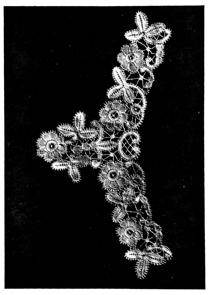 An illustration from The art of bobbin lace : a practical text book of workmanship in antique and modern lace including Geneoese, point de flandre bruges guipure, duchesse, Honiton, "raised" Honiton, applique, and Bruxelles : also how to clean and repair valuable lace, etc., 1911, leaf 59
