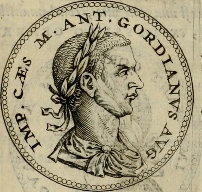 An illustration from De vita et moribus imperatorum Romanorum: excerpta ex libris Sexti Aurelii Victoris, à Caesare Augusto usque ad Theodosium imperatorem. Andreas Schottus compositis tribus M.SS. cum Vett. vulgatis emendabat; scholiis & veris iconibus ex antiquis numismatis delineatis illustrabat. Quibus accesserunt & Eliae Vineti notae, 1669, leaf 87