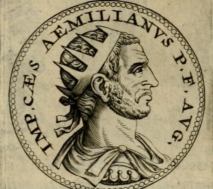 An illustration from De vita et moribus imperatorum Romanorum: excerpta ex libris Sexti Aurelii Victoris, à Caesare Augusto usque ad Theodosium imperatorem. Andreas Schottus compositis tribus M.SS. cum Vett. vulgatis emendabat; scholiis & veris iconibus ex antiquis numismatis delineatis illustrabat. Quibus accesserunt & Eliae Vineti notae, 1669, leaf 91