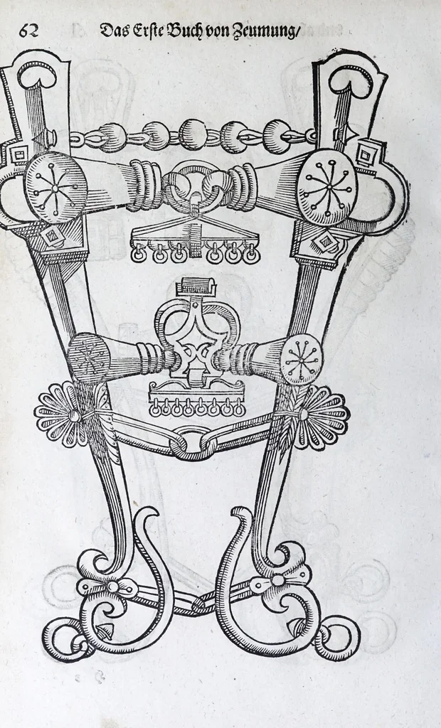 An illustration from Hippopronia : grundtlicher vnnd eigentlicher Bericht inn zwey Bücher verfasset : erstlichen, von Art vnd Eygenschafft der Pferde, wie die auff allerhand vnd vilfaltige Manieren vnd Weisen zu zeumen vnnd abzurichten : mit darzu gehöriger Mundstucken vnd Stangen, vff vnd Abrisse vnd andern künstlichen Figurẽ vorgebildt : so dann fürs ander von derselben Zufäll vnnd Kranckheiten, auch bewehrter Mittel, Curation vnd heilsamen Artzneyen gegründte Beschreibung : alles durch langwirige Erfahrung ... zusam̃en gebracht, vnd ... vor Jaren in Truck verfertigt, 1599, leaf 74