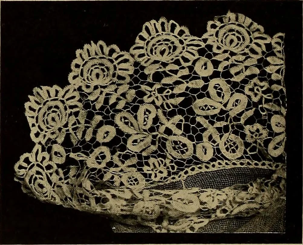 An illustration from A history of hand-made lace : Dealing with the origin of lace, the growth of the great lace centres, the mode of manufacture, the methods of distinguishing and the care of various kinds of lace ..., 1900, leaf 125
