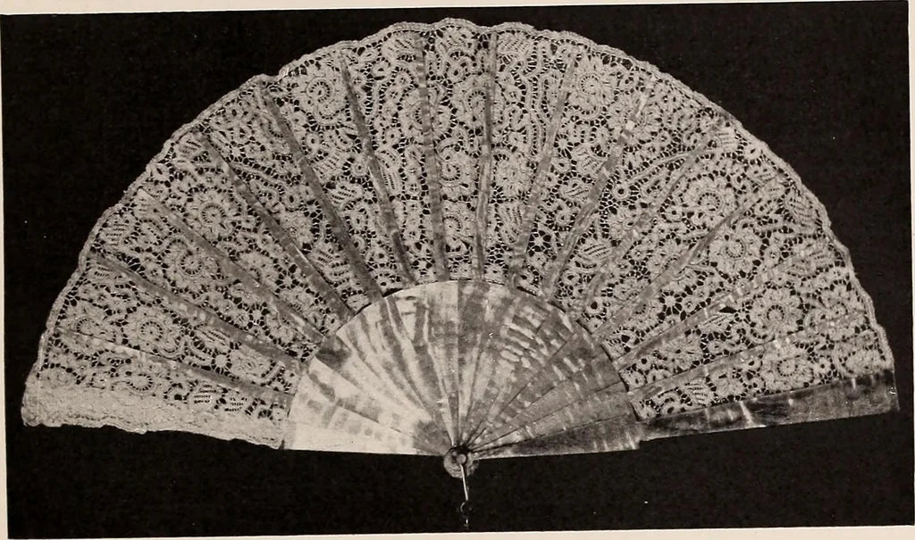 An illustration from A history of hand-made lace : dealing with the origin of lace, the growth of the great lace centres, the mode of manufacture, the methods of distinguishing and the care of various kinds of lace, 1900, leaf 102