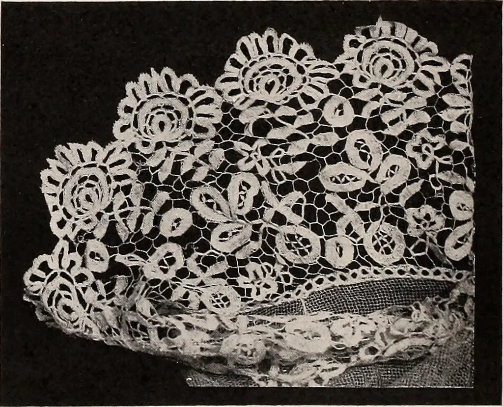 An illustration from A history of hand-made lace : dealing with the origin of lace, the growth of the great lace centres, the mode of manufacture, the methods of distinguishing and the care of various kinds of lace, 1900, leaf 125