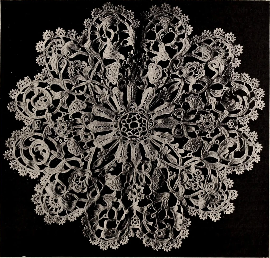 An illustration from A history of hand-made lace : dealing with the origin of lace, the growth of the great lace centres, the mode of manufacture, the methods of distinguishing and the care of various kinds of lace, 1900, leaf 184