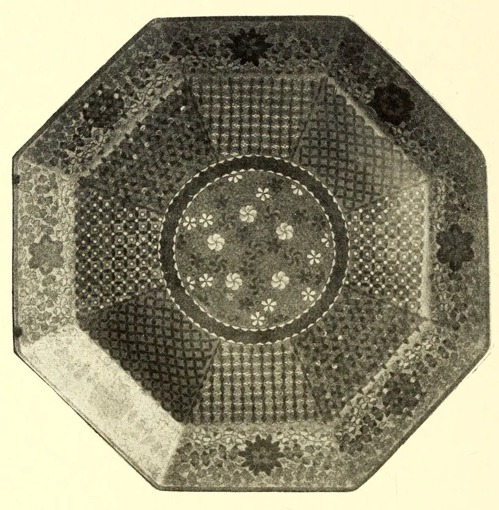 An illustration from Illustrated Catalogue of the Noteworthy Collection of Cloisonne and Other Enamels, Old Japanese Bronzes, Sword Guards, Knife Handles, Swords, Lacquers and Fine Old Brocades : belonging to Dr. Alfred Owre of Minneapolis, 1917, leaf 120