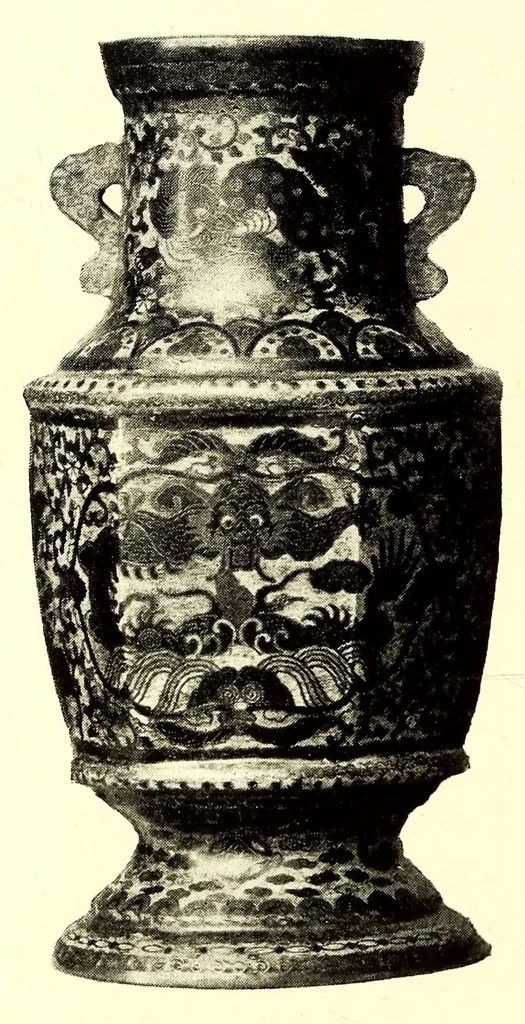An illustration from Illustrated Catalogue of the Noteworthy Collection of Cloisonne and Other Enamels, Old Japanese Bronzes, Sword Guards, Knife Handles, Swords, Lacquers and Fine Old Brocades : belonging to Dr. Alfred Owre of Minneapolis, 1917, leaf 142