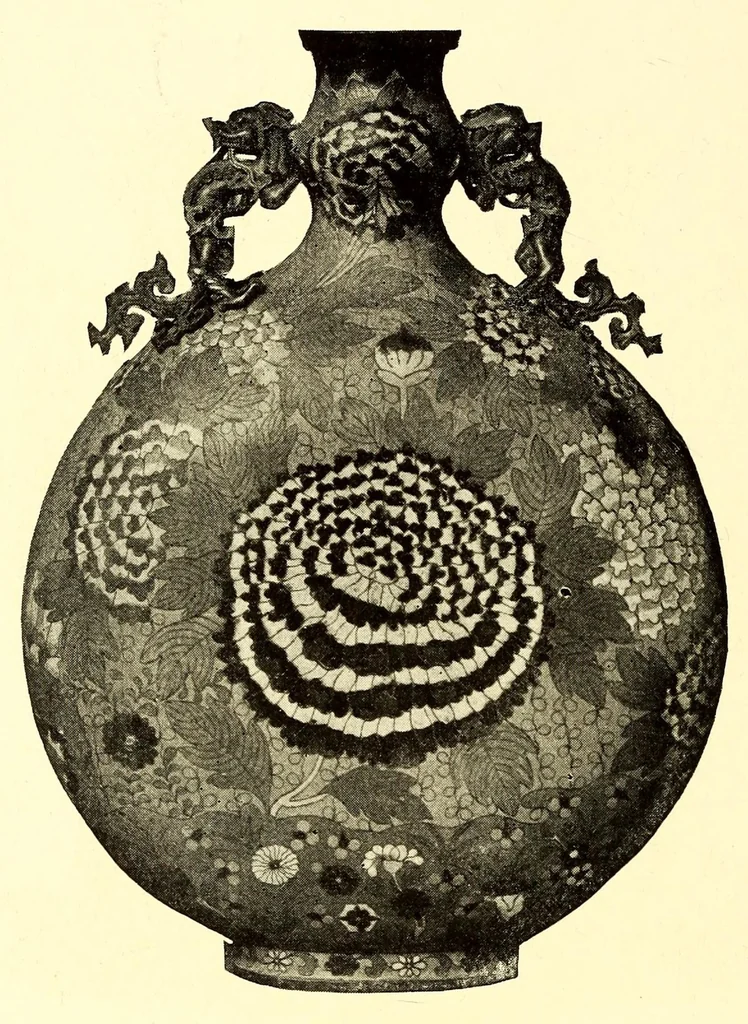 An illustration from Illustrated Catalogue of the Noteworthy Collection of Cloisonne and Other Enamels, Old Japanese Bronzes, Sword Guards, Knife Handles, Swords, Lacquers and Fine Old Brocades : belonging to Dr. Alfred Owre of Minneapolis, 1917, leaf 156
