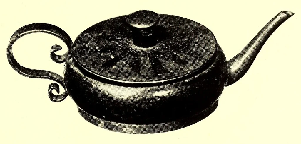 An illustration from Illustrated Catalogue of the Noteworthy Collection of Cloisonne and Other Enamels, Old Japanese Bronzes, Sword Guards, Knife Handles, Swords, Lacquers and Fine Old Brocades : belonging to Dr. Alfred Owre of Minneapolis, 1917, leaf 31