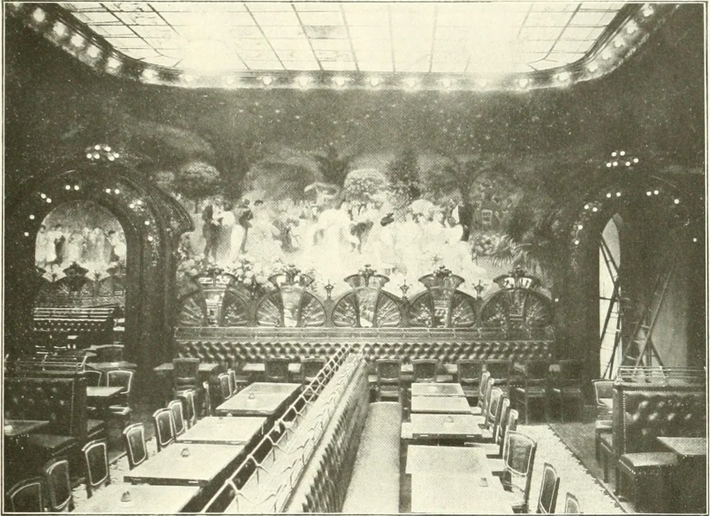 An illustration from L'art à la Taverne de Paris. Chéret, Abel Faivre, Grün, Léandre, Métivet, Steinlen, Willette, artistes peintres. Emile Robert, ferronnier d'art. Jacques Hermant, architecte. Photogravures de Ducourtioux et Huillard, d'après les clichés de Simonet, 1906, leaf 9