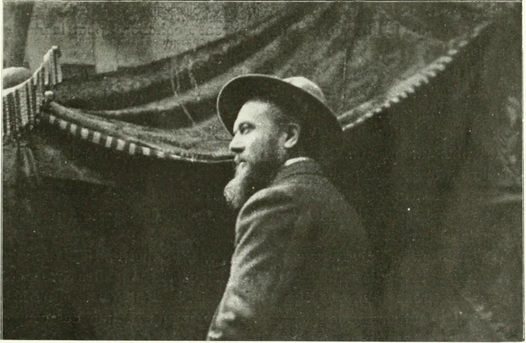 An illustration from L'art à la Taverne de Paris. Chéret, Abel Faivre, Grün, Léandre, Métivet, Steinlen, Willette, artistes peintres. Emile Robert, ferronnier d'art. Jacques Hermant, architecte. Photogravures de Ducourtioux et Huillard, d'après les clichés de Simonet, 1906, leaf 99