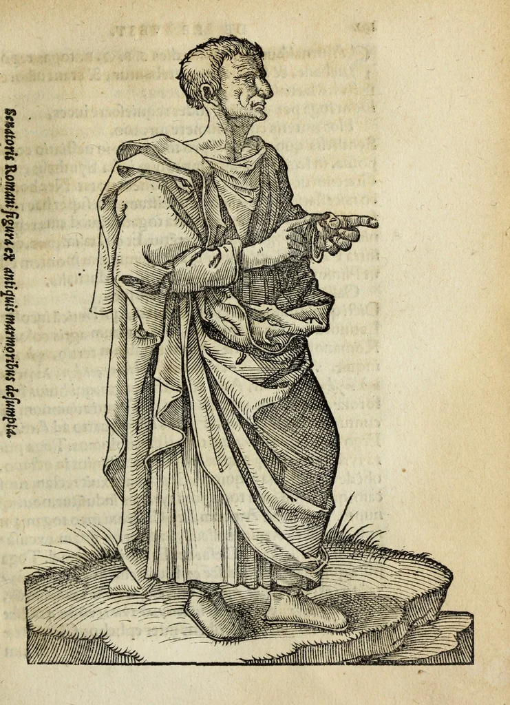 An illustration from Lazari Bayfii annotationes in legem II : De captiuis & postliminio reuersis, in quibus tractatur De re nauali, per autorem recognitæ : eivsdem annotationes in tractatum De auro & argento legato, quibus vestimẽtoru ̃& vasculorũ genera explicat̃ur : his omnibus imagines ab antiquissimis monumentis desumptas ad argumenti declaratione ̃subiunximus. Item Antonii Thylesii De coloribus libellus, à coloribus uestium non alienus, 1537, leaf 194