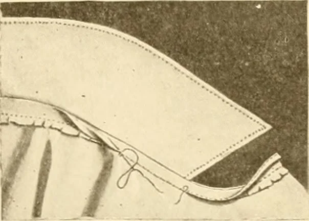 An illustration from The new dressmaker; with complete and fully illustrated instructions on every point connected with sewing, dressmaking and tailoring, from the actual stitches to the cutting, making, altering, mending, and cleaning of clothes for ladies, misses, girls, children, infants, men and boys, 1921, leaf 112