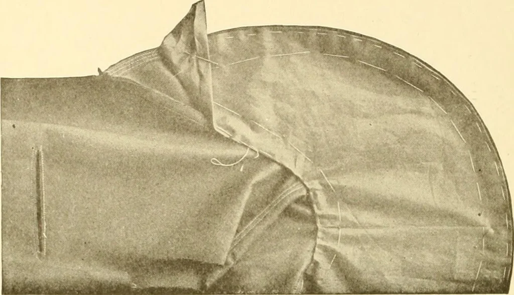 An illustration from The new dressmaker; with complete and fully illustrated instructions on every point connected with sewing, dressmaking and tailoring, from the actual stitches to the cutting, making, altering, mending, and cleaning of clothes for ladies, misses, girls, children, infants, men and boys, 1921, leaf 113