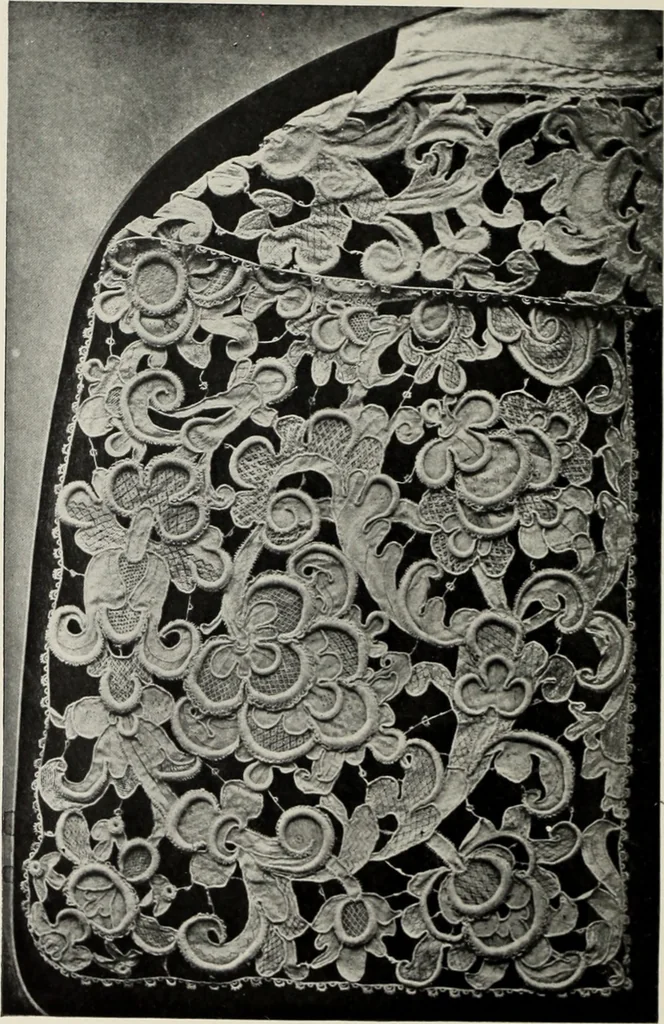 An illustration from Old lace : a handbook for collectors; an account of the different styles of lace, their history, characteristics & manufacture, 1908, leaf 7