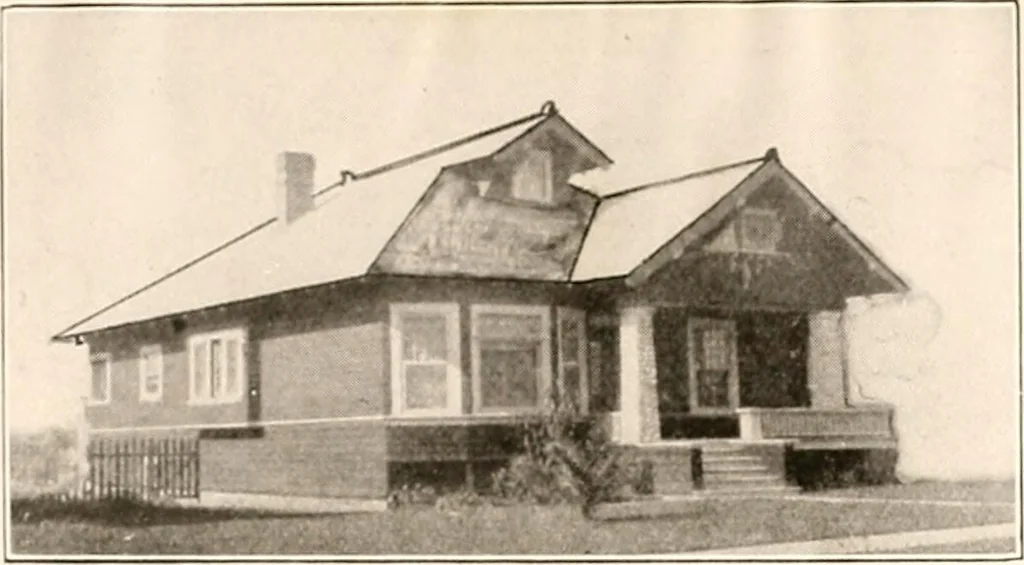An illustration from The plan book of American dwellings : being a compilation of original home designs, showing actual photographic exteriors and floor plans of moderately priced bungalows, cottages, residences, 1914, leaf 214