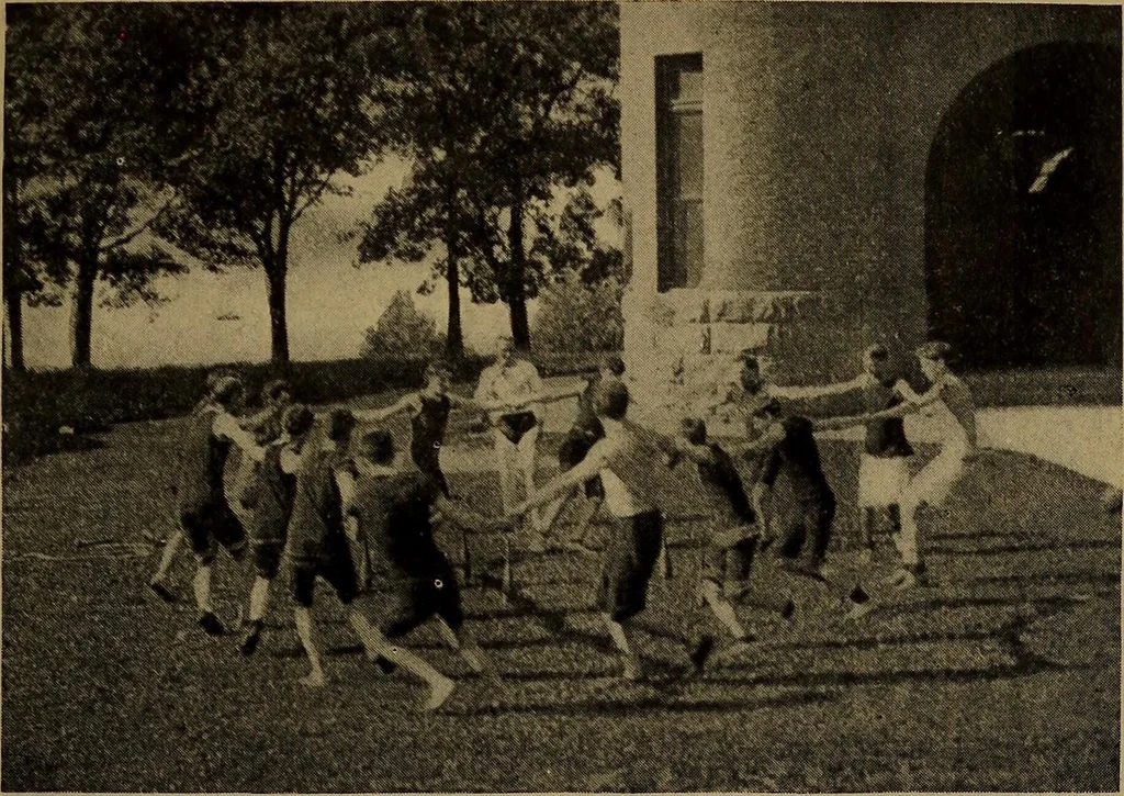 An illustration from Play, comprising games for the kindergarten, playground, schoolroom and college; how to coach and play girls' basket-ball, etc, 1912, leaf 204