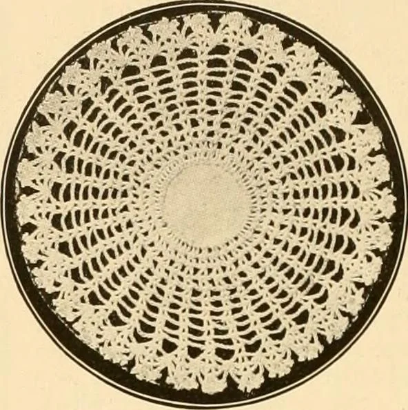 An illustration from The Priscilla crochet book, centerpieces and doilies;, 1915, leaf 23