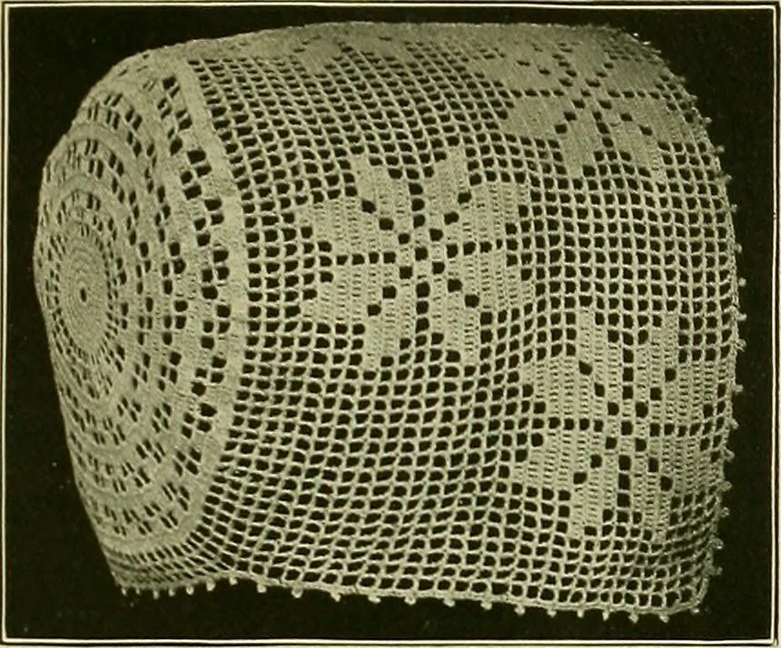 An illustration from The Priscilla filet crochet book : a collection of beautiful designs in filet crochet, equally adapted to cross-stitch beads and canvas with working directions, 1915, leaf 24