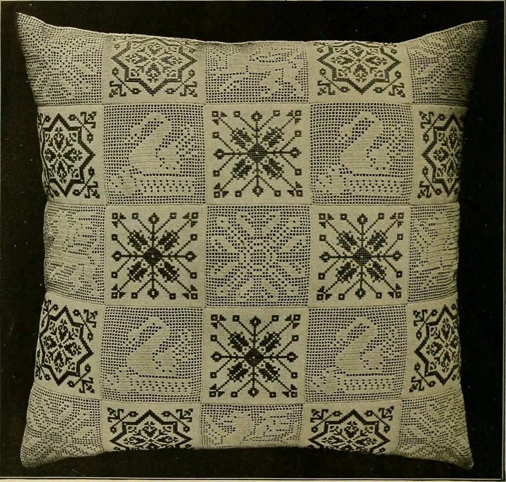An illustration from The Priscilla filet crochet book : a collection of beautiful designs in filet crochet, equally adapted to cross-stitch beads and canvas with working directions, 1915, leaf 7