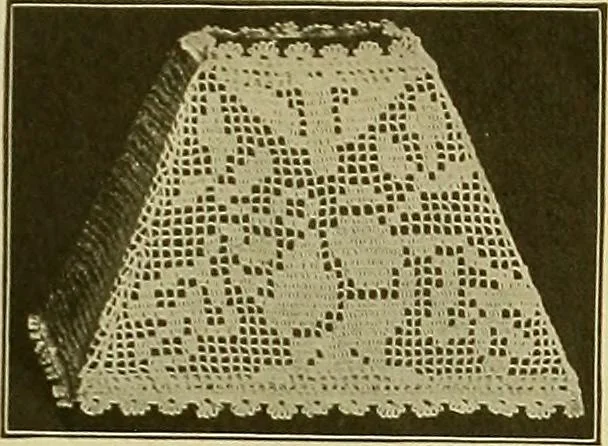 An illustration from The Priscilla filet crochet book, no. 2 ; a collection of beautiful designs in filet crochet, introducing filet crochet brodé, embroidery on crochet and cameo crochet, 1914, leaf 14