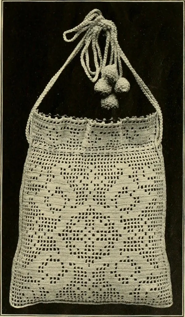 An illustration from The Priscilla filet crochet book; a collection of beautiful designs in filet crochet, equally adapted to cross-stitch, beads and canvas, with working directions, 1911, leaf 20