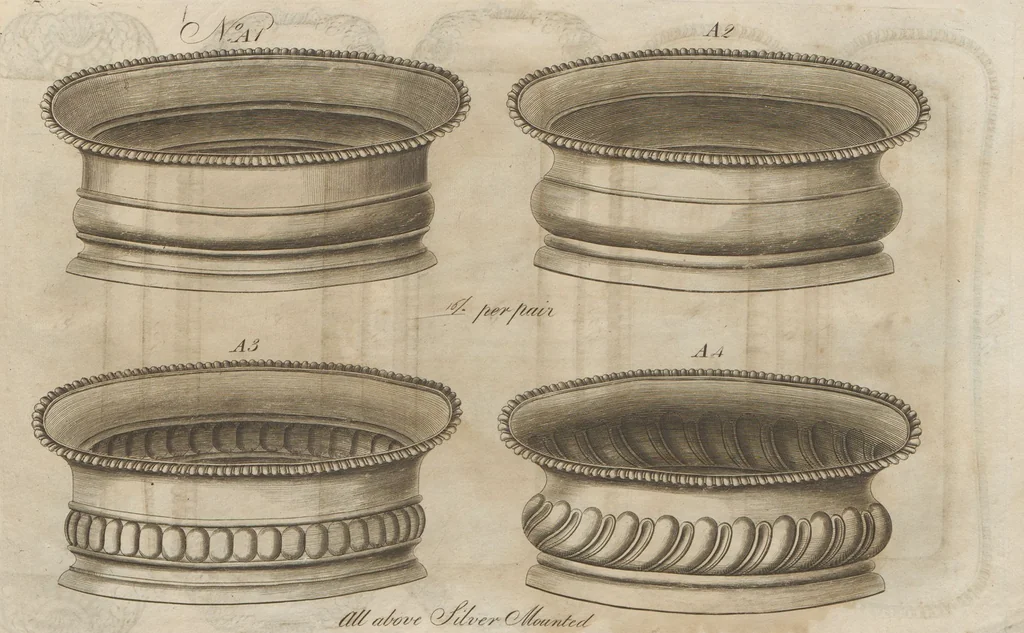 An illustration from Engraved pattern book or trade catalogue of Sheffield plate, including cruet, soy frames, dinnerware, soup tureens, sauce boats, platters, coasters, salt cellars, mustard pots, serving pieces, utensils, cake baskets, tea urns, candlesticks, candelabra, oil lamps, snuffers and more, 1800, leaf 85