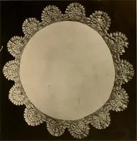 An illustration from Center pieces and lungh sets in crochet work .. (1915)