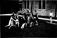 An illustration from Play, comprising games for the kindergarten, playground, schoolroom and college; how to coach and play girls' basket-ball, etc (1918)