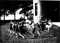 An illustration from Play, comprising games for the kindergarten, playground, schoolroom and college; how to coach and play girls' basket-ball, etc (1918)