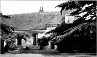 An illustration from Small French buildings; the architecture of town and country, comprising cottages, farmhouses, minor chateaux or manors with their farm groups, small town dwellings, and a few churches (1921)