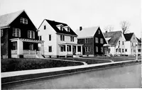 An illustration from The housing book; containing photographic reproductions, with floor plans of workingmen's homes. One and two family houses of frame, brick, stucco and concrete construction; also four, six and nine family apartments. Showing single houses, groups and developments that have been built in various parts of the United States (1919)