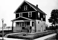 An illustration from The housing book; containing photographic reproductions, with floor plans of workingmen's homes. One and two family houses of frame, brick, stucco and concrete construction; also four, six and nine family apartments. Showing single houses, groups and developments that have been built in various parts of the United States (1919)