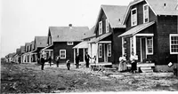Picture 130 of 171 from The housing book; containing photographic reproductions, with floor plans of workingmen's homes. One and two family houses of frame, brick, stucco and concrete construction; also four, six and nine family apartments. Showing single houses, groups and developments that have been built in various parts of the United States (1919), leaf 110