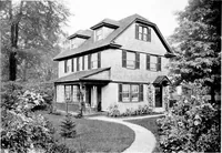 An illustration from The housing book; containing photographic reproductions, with floor plans of workingmen's homes. One and two family houses of frame, brick, stucco and concrete construction; also four, six and nine family apartments. Showing single houses, groups and developments that have been built in various parts of the United States (1919)
