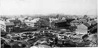 An illustration from The housing book; containing photographic reproductions, with floor plans of workingmen's homes. One and two family houses of frame, brick, stucco and concrete construction; also four, six and nine family apartments. Showing single houses, groups and developments that have been built in various parts of the United States (1919)