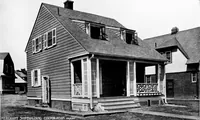 Picture 44 of 171 from The housing book; containing photographic reproductions, with floor plans of workingmen's homes. One and two family houses of frame, brick, stucco and concrete construction; also four, six and nine family apartments. Showing single houses, groups and developments that have been built in various parts of the United States (1919), leaf 54