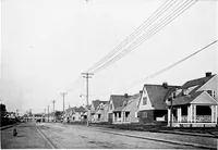 An illustration from The housing book; containing photographic reproductions, with floor plans of workingmen's homes. One and two family houses of frame, brick, stucco and concrete construction; also four, six and nine family apartments. Showing single houses, groups and developments that have been built in various parts of the United States (1919)