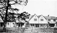 An illustration from The housing book; containing photographic reproductions, with floor plans of workingmen's homes. One and two family houses of frame, brick, stucco and concrete construction; also four, six and nine family apartments. Showing single houses, groups and developments that have been built in various parts of the United States (1919)