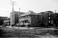 An illustration from The housing book; containing photographic reproductions, with floor plans of workingmen's homes. One and two family houses of frame, brick, stucco and concrete construction; also four, six and nine family apartments. Showing single houses, groups and developments that have been built in various parts of the United States (1919)