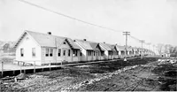 Picture 109 of 171 from The housing book; containing photographic reproductions, with floor plans of workingmen's homes. One and two family houses of frame, brick, stucco and concrete construction; also four, six and nine family apartments. Showing single houses, groups and developments that have been built in various parts of the United States (1919), leaf 94