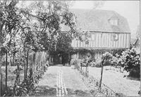 An illustration from Picturesque English cottages and their doorway gardens (1905)
