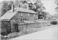 An illustration from Picturesque English cottages and their doorway gardens (1905)